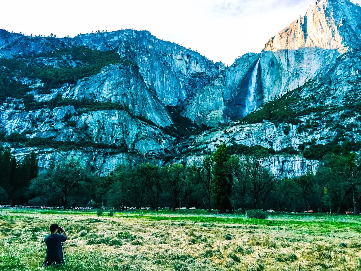 Yosemite Valley framed by granite mountains in cool blue light